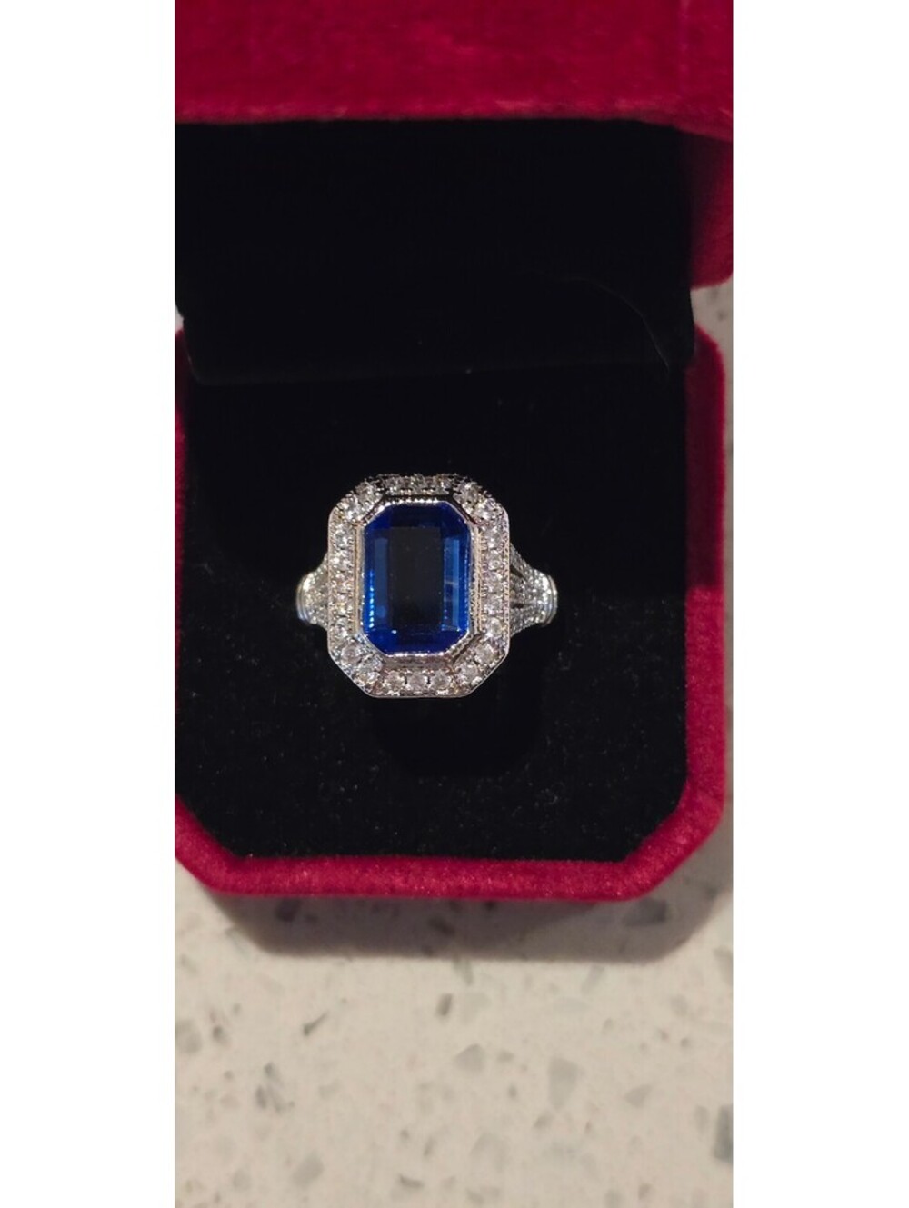 Lab Created Sapphire surrounded by White Sapphire sz 8 set in S925